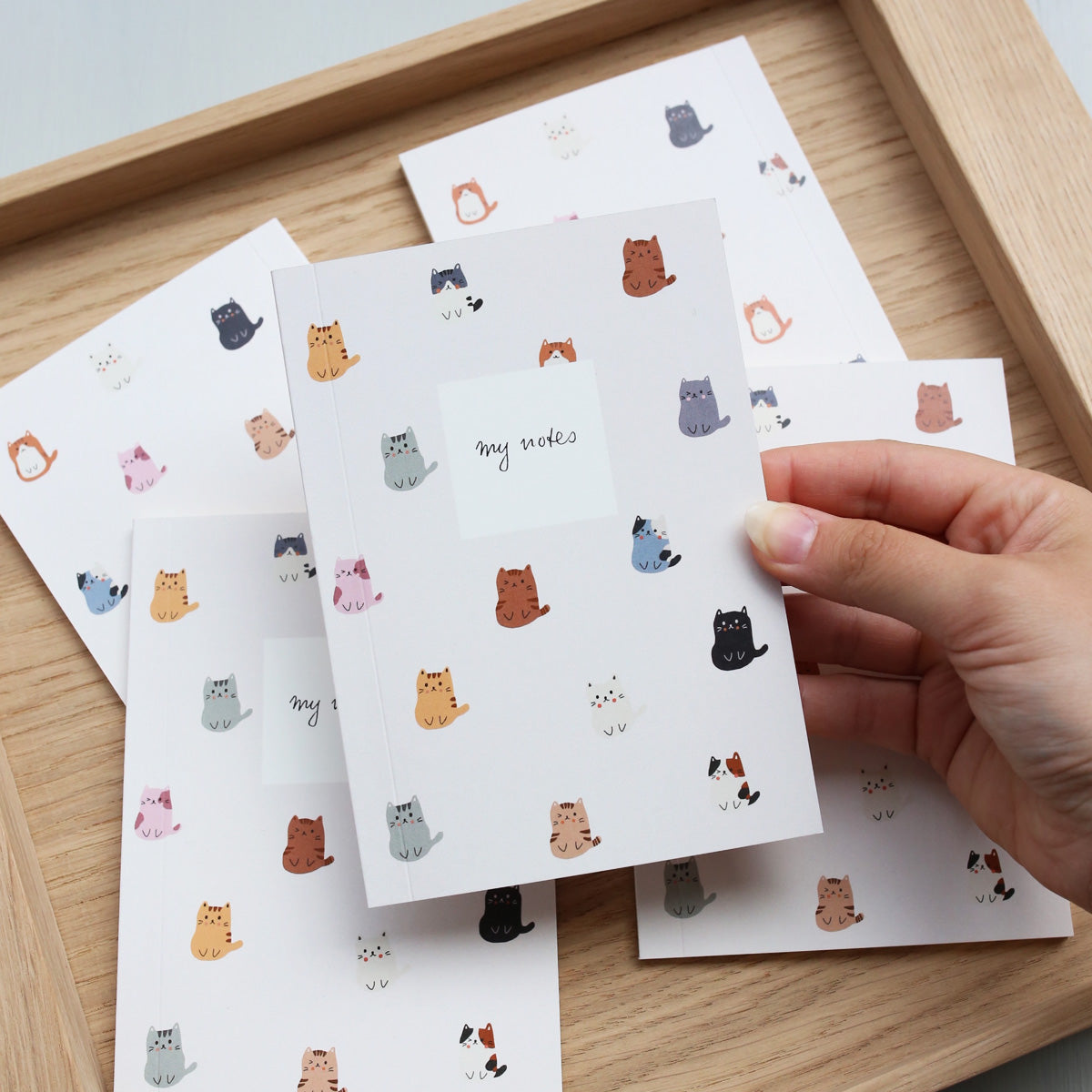small pocket notebook with cats