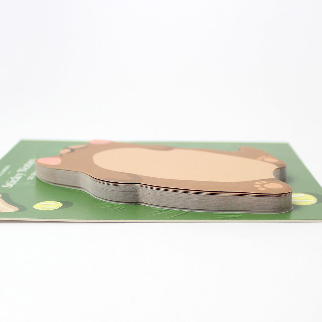 Dog-shaped sticky notes on a green base with a white background