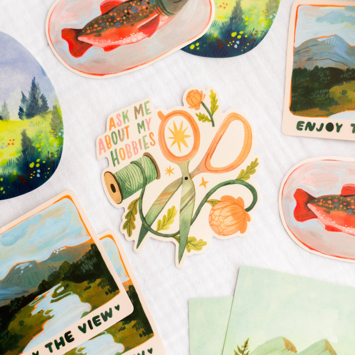 Collection of colorful stickers with nature-themed designs and text on a white background.