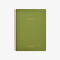 Green notebook with spiral binding on a white background