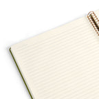 Open notebook with spiral bound with lines.