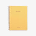 Yellow notebook with spiral binding on a white background
