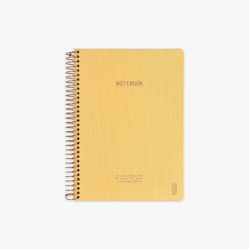 Yellow notebook with spiral binding on a white background