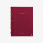 Red notebook with spiral binding on a white background