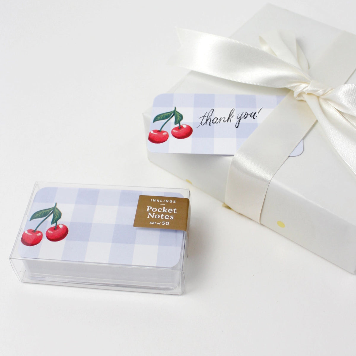 Pack of pocket notes with cherry design and 'thank you' label on a white background