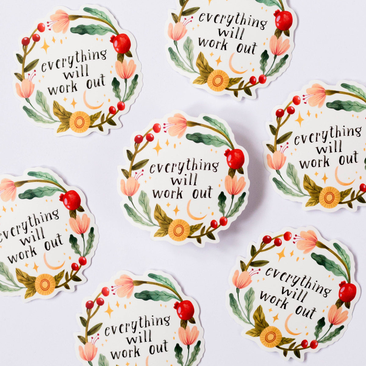 Motivational stickers with floral designs and 'everything will work out' text on a white background