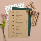 Wedding invitation with icons, stamps, and a flower on a beige background