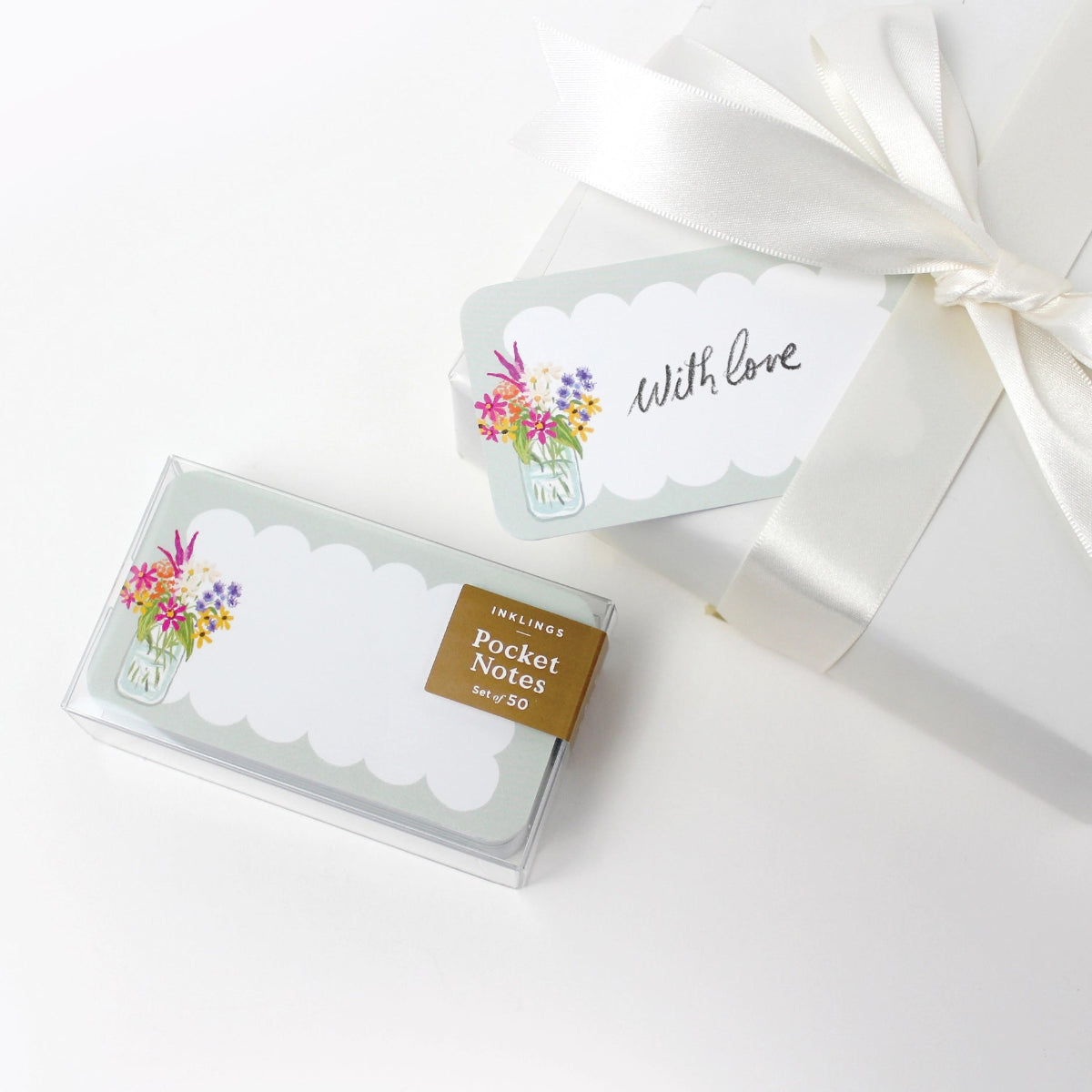 Pocket notes with floral design packaging on a white background