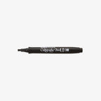 Black calligraphy pen on a white background