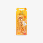 Packaged correction and glue tape with a cute bear design on a grey background
