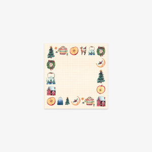 Sticky notes with Christmas-themed stickers on a white background