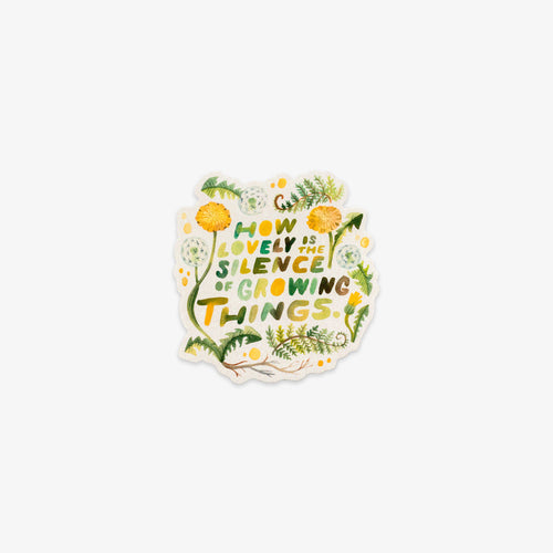 A die-cut sticker featuring the quote 'HOW LOVELY IS THE SILENCE OF GROWING THINGS.' in green and yellow lettering, surrounded by watercolor-style green leaves, yellow flowers, and small white dots on a white background.