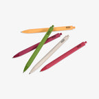 Five colorful ballpoint pens with 'KOZO' branding