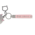 Keychain with cat design and 'BE CURIOUS' tag on a white background