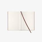 Open notebook with a brown ribbon
