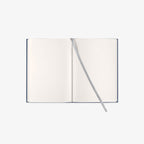 Open notebook with blank pages on a white background