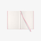 Open notebook with a pink and grey ribbon