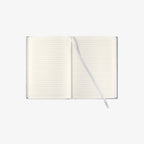 Open notebook with lined pages on a white background