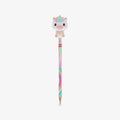A pastel-colored pencil with a cute cartoon unicorn squishy character on top, set against a plain light gray background.