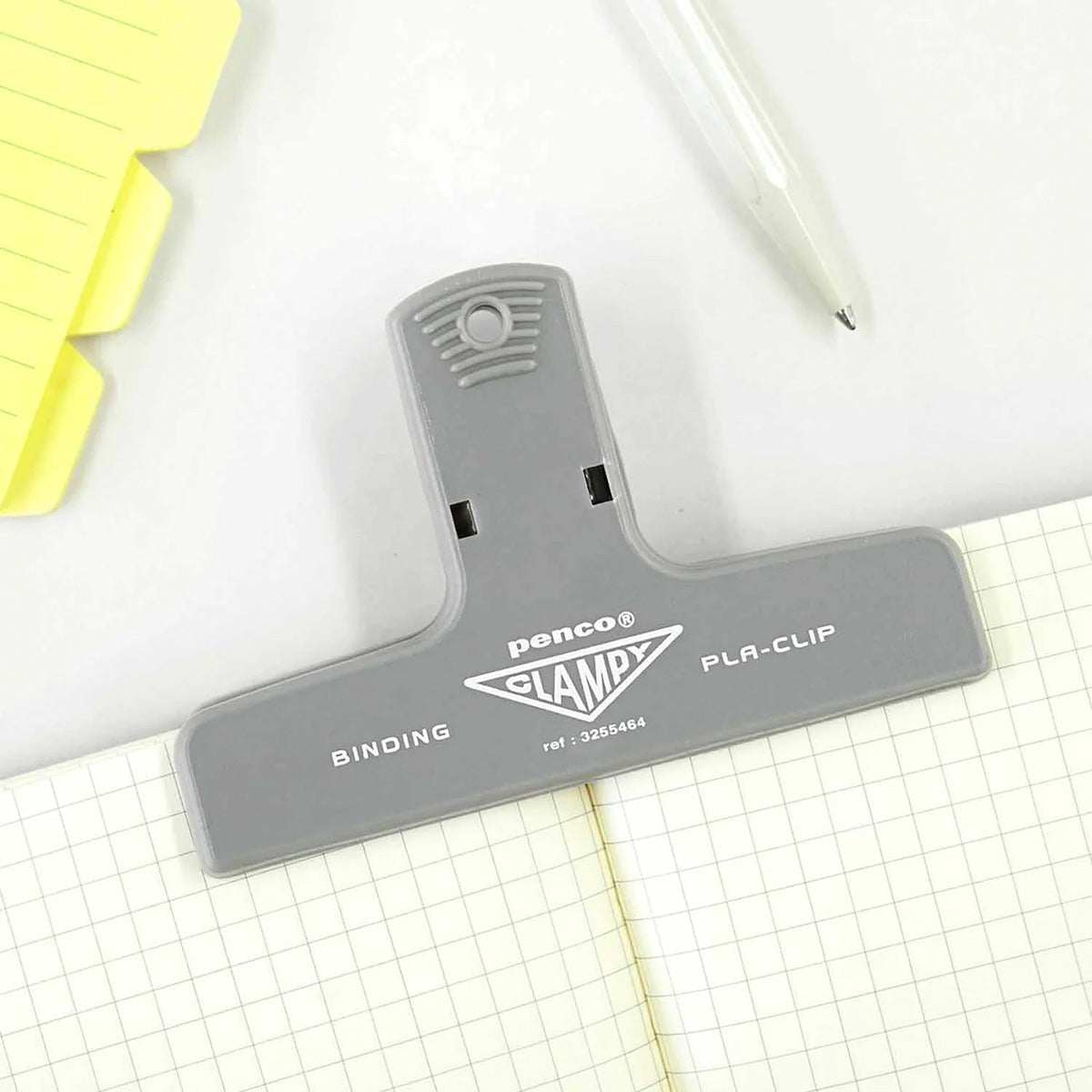 Grey clamp holding a journal
