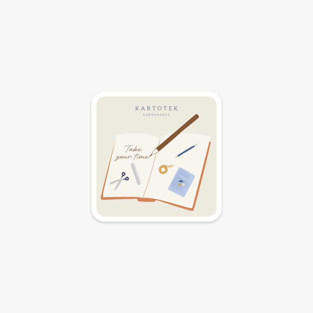 Vinyl sticker with stationery items, Kartotek Copenhagen logo and 'Take your time' text on a white background